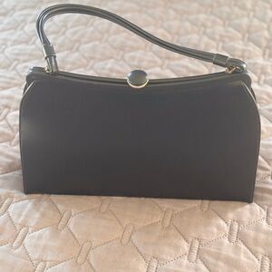 Black Clutch with Gold-Toned Clasp and Textured Finish